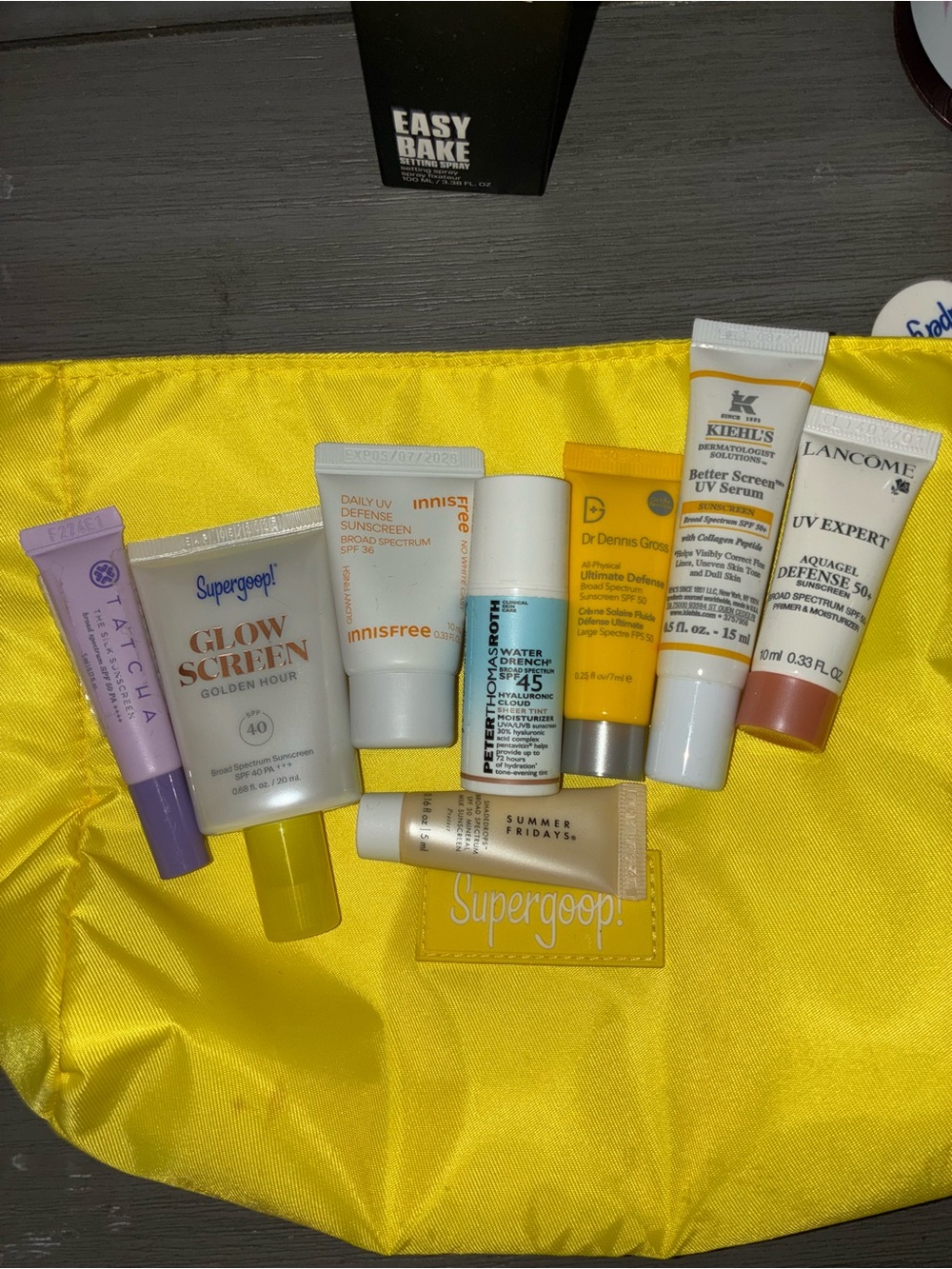 Super goop  Yellow Cosmetic Pouch with Assorted Sunscreen Tubes